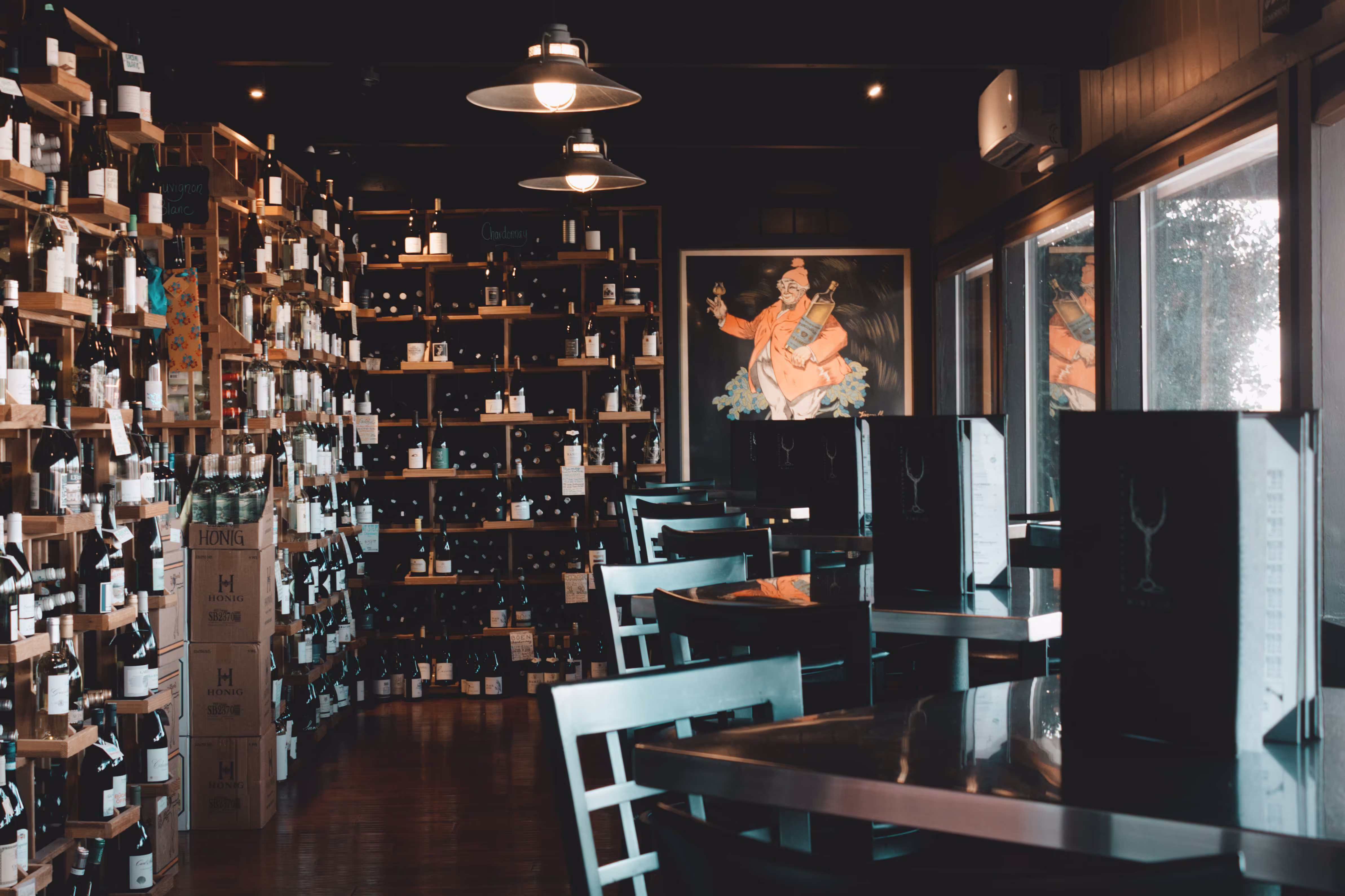 Warmly lit Whispering Vine dining room and wine bar